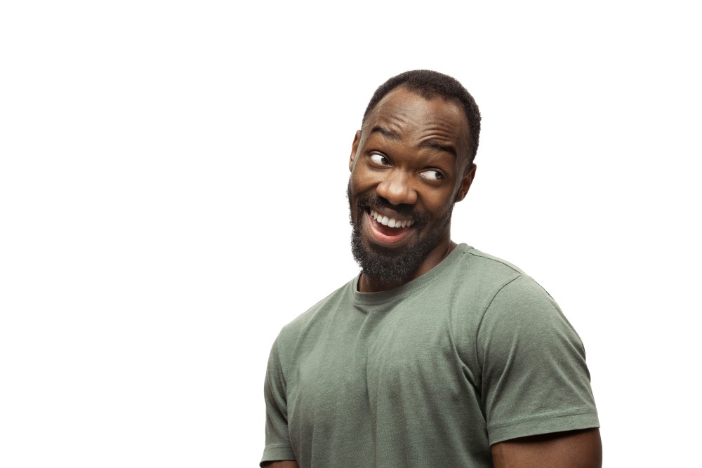 young african american man with funny unusual popular emotions gestures isolated white
